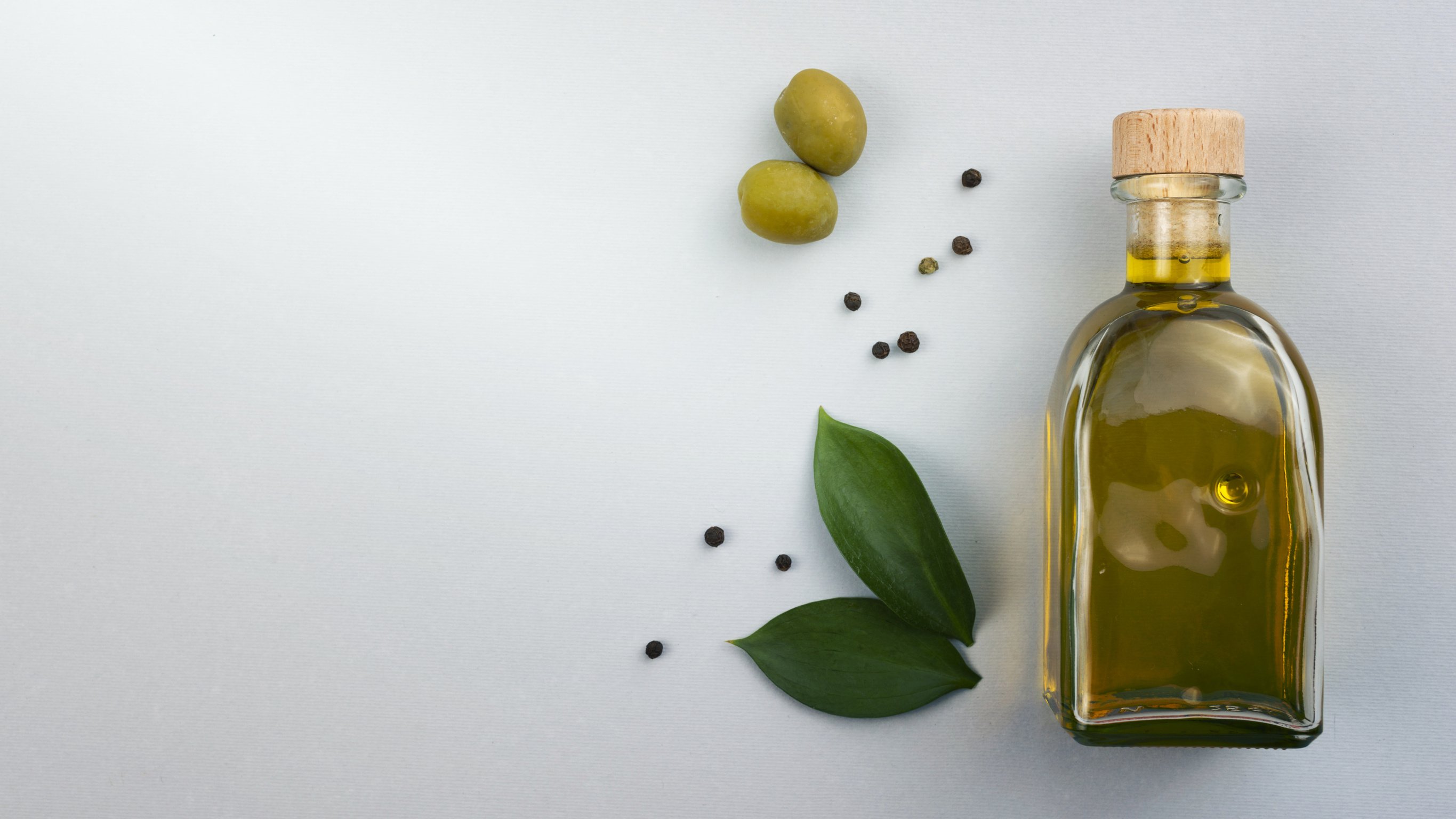 Olive Oil Bottle with Leaves Olives Table